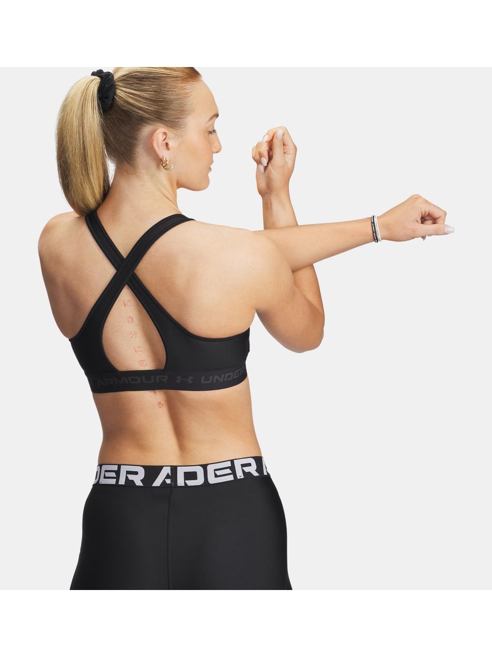 Top Sportivo Under Armour CROSSBACK MID BRA Donna - Nero